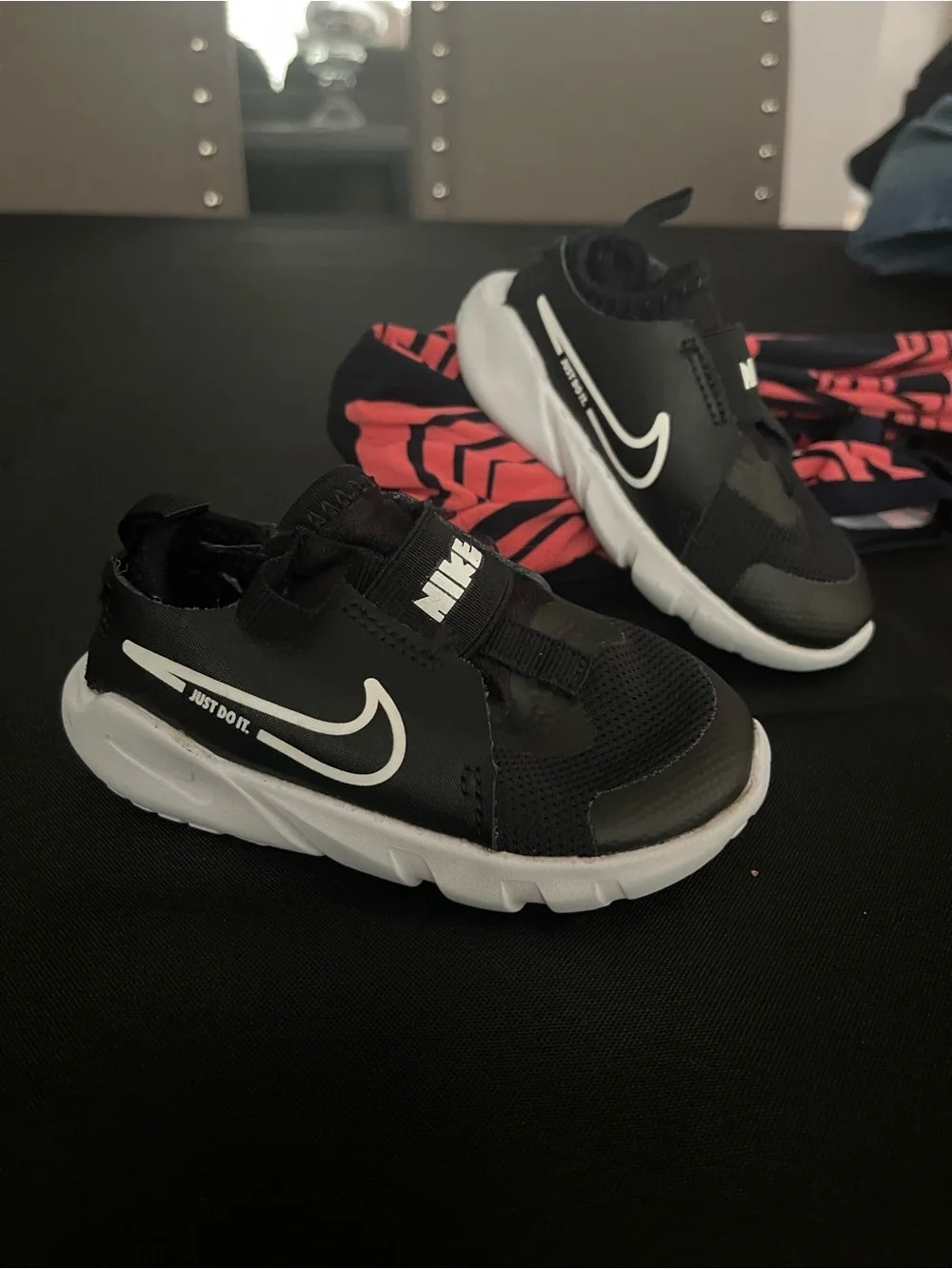 Nike Kids Black and White Slip-On Sneakers with Swoosh